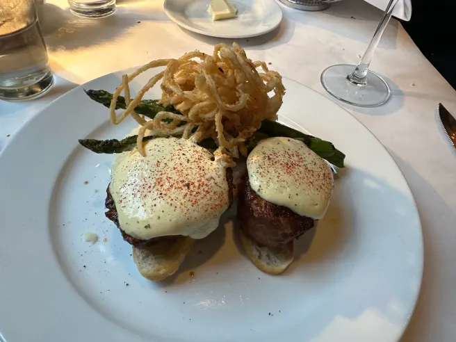 Lindey's signature dishes Tournedos of Beef, Lobster Bisque, Seared Scallops, Lindey's Post Mortem, and Steak Frites